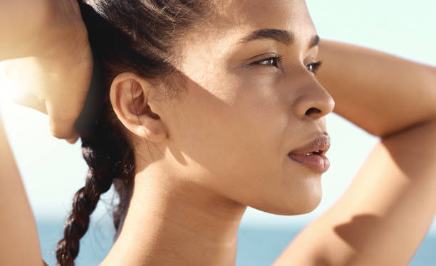 istock Close up of a beautiful female athletes face while taking a break while stretching and putting her hands behind her head 1400267789