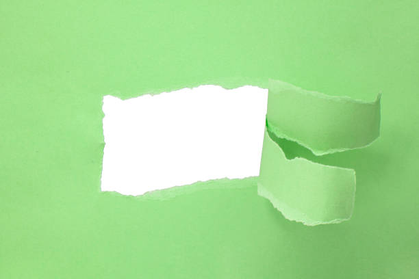 istock Paper green color background with hole copyspace 1400268537