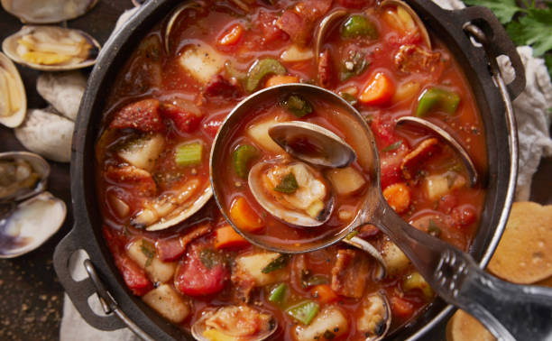 Manhattan Clam Chowder Manhattan Clam Chowder with Potatoes, Carrots, Celery, Onion and Bacon serving utensil stock pictures, royalty-free photos & images