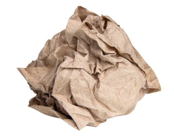istock Crumpled brown paper ball isolated on the white background 1400270310