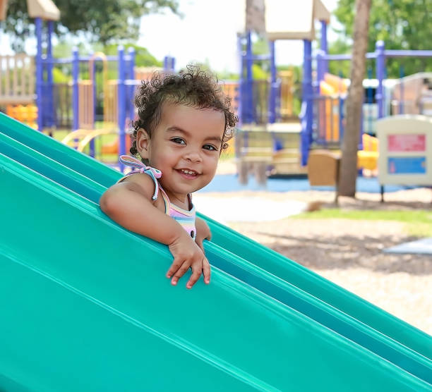 Young Girl on Slide stock photo