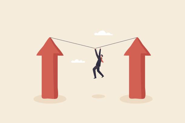 istock business man climbing on top of financial growing graph using rope, investment growth targets concept 1400271655