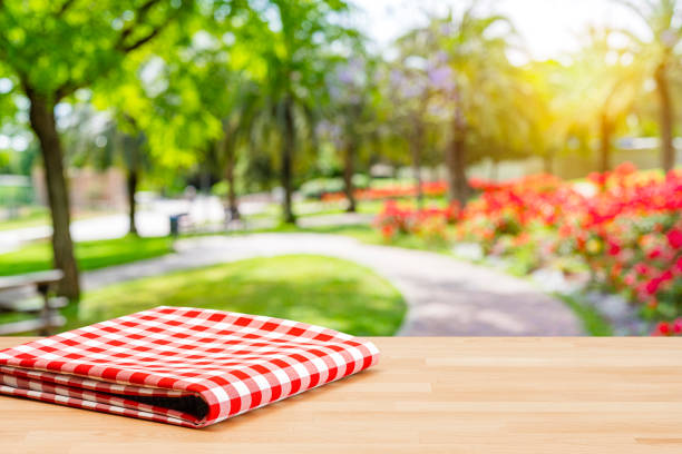 istock Picnic table with folded tablecloth in a public park 1400273758
