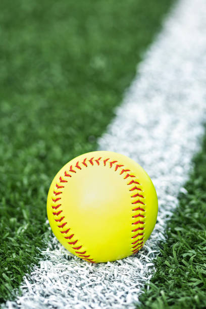 istock A softball sitting on the turf on the white baseline 1400274698