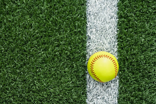 istock Looking down on a softball sitting on the white baseline 1400275257