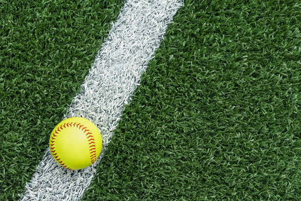 istock Looking down on a softball sitting on the white baseline 1400275385