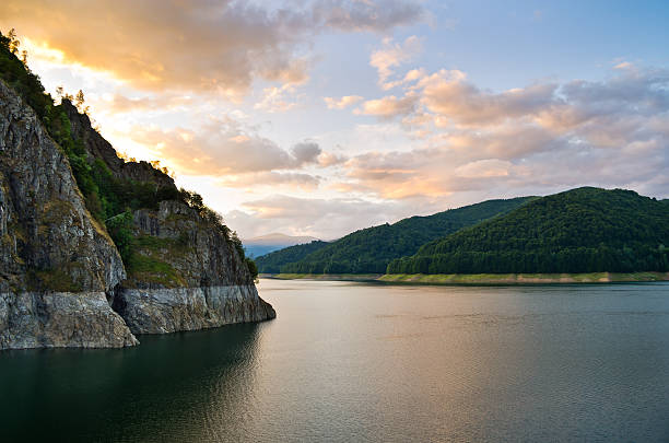istock sunset and mountain lake 140027727