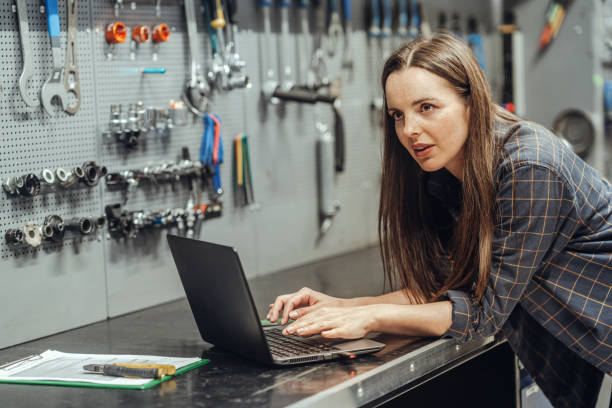 istock Female Bicycle Mechanic with laptop 1400277270