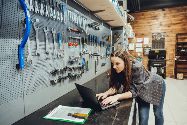 istock Female Bicycle Mechanic with laptop 1400277301