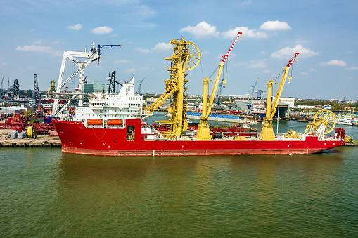 cargo vessel in sea port, Rotterdam, Netherlands.