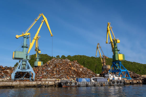 Cranes loading scrap metal In port