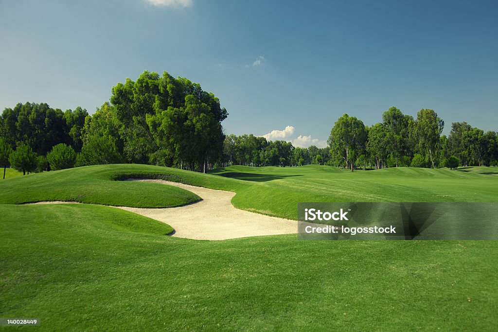 Beautiful golf course with sand trap sand traps at a course Golf Stock Photo