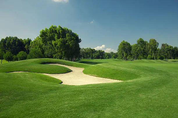 Photo of Beautiful golf course with sand trap
