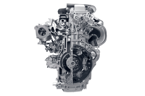 Car engine in front of white background