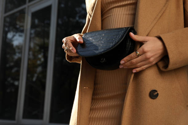 istock Young woman with stylish waist bag outdoors, closeup 1400284607