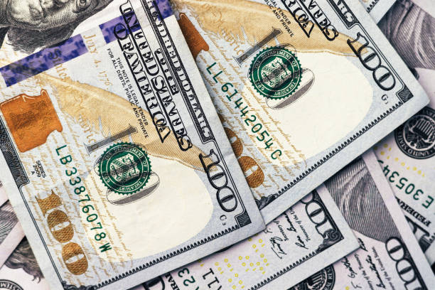 istock American paper dollar bills background 1400285786