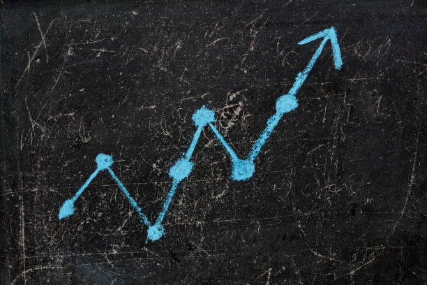 istock Up arrow drawn in chalk on an old blackboard 1400286219