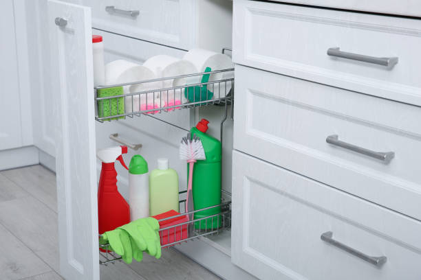 istock Open drawer with different cleaning supplies in kitchen 1400290369