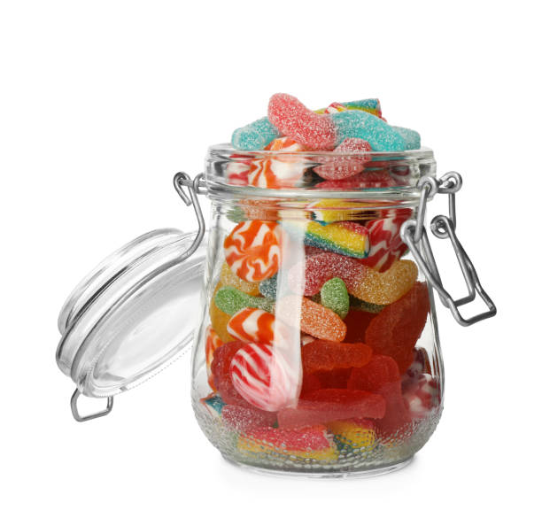 istock Many different candies in glass jar isolated on white 1400290957