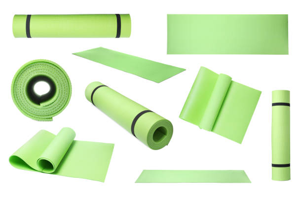 Set with green camping mats on white background