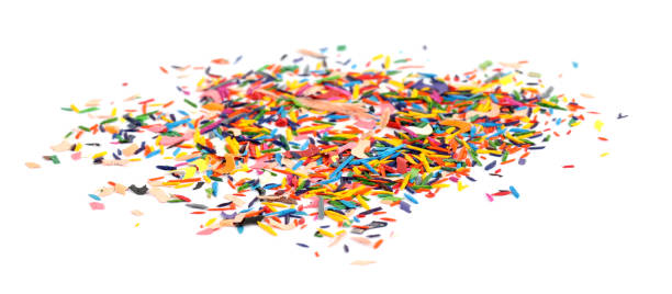 istock Colorful graphite crumbs on white background. Pencil sharpening 1400291600