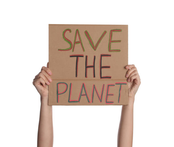 istock Protestor holding placard with text Save The Planet on white background, closeup. Climate strike 1400291659