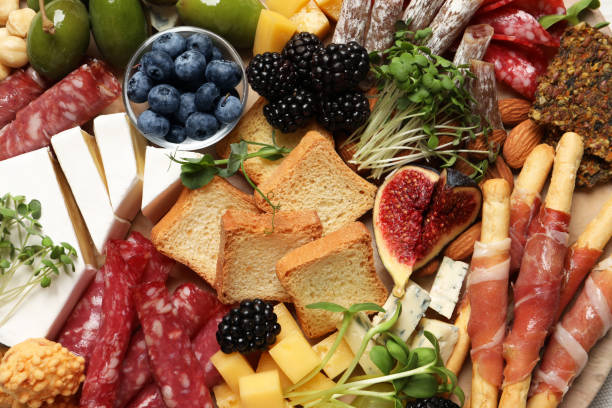 istock Different tasty appetizers as background, top view 1400291736