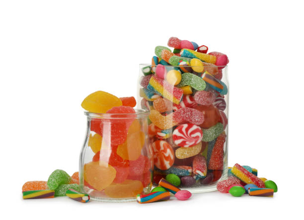 istock Glass jars with different candies on white background 1400291798