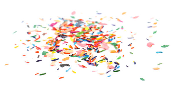 istock Colorful graphite crumbs on white background. Pencil sharpening 1400292465