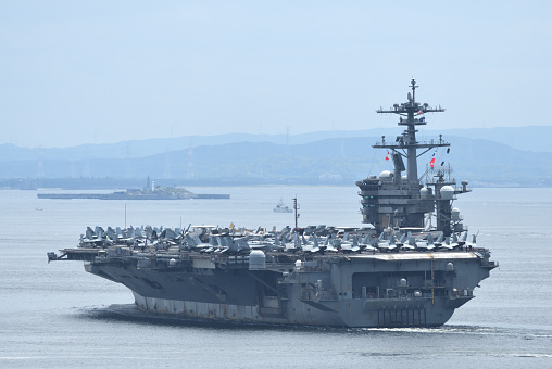 Kanagawa, Japan - June 01, 2022: United States Navy USS Abraham Lincoln (CVN-72), Nimitz-class aircraft carrier sailing in Tokyo bay.