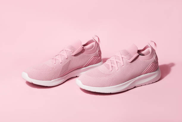 istock Pink pastel color sneakers on background 1400292968