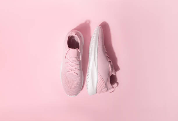 istock Pink pastel color sneakers on background 1400292971