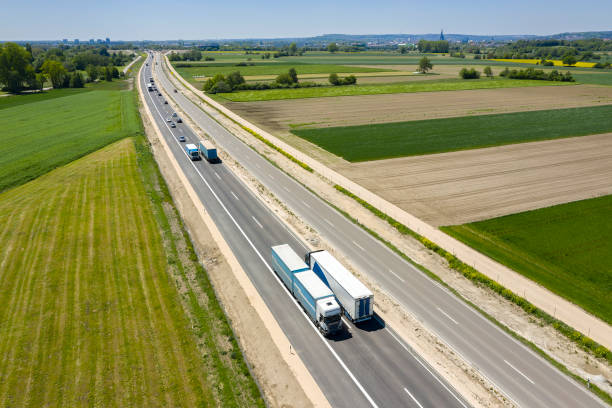 istock Multiple Lane Highway with Trucks and Cars from Above 1400300063