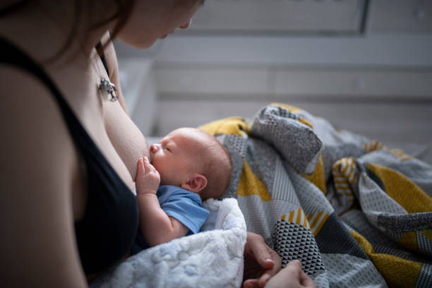 istock Newborn baby boy being breastfed. 1400300353