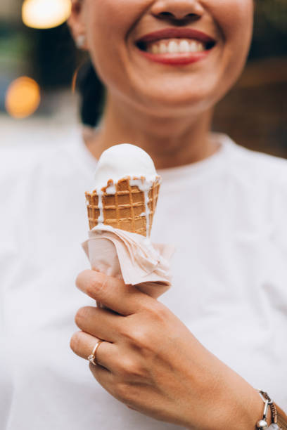 istock Anonymous Woman Holding An Ice Cream 1400301537