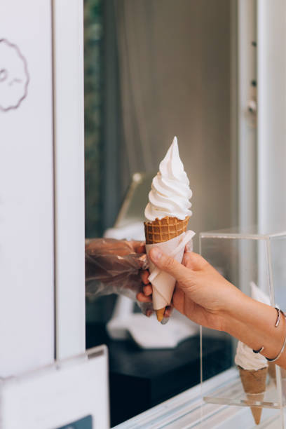 istock Anonymous Woman Buying An Ice Cream 1400301552