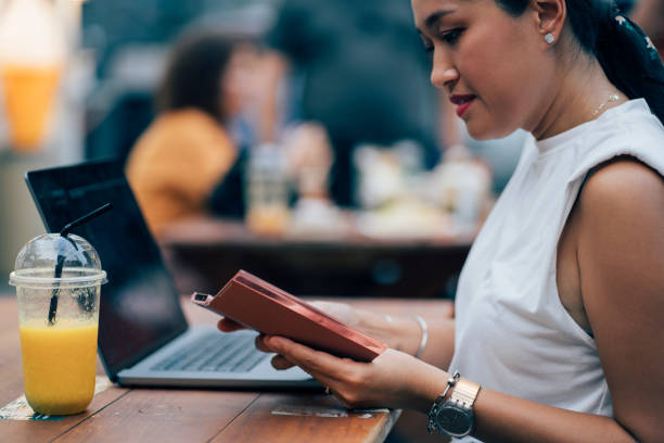 istock Asian Woman Working On Her Laptop 1400301571