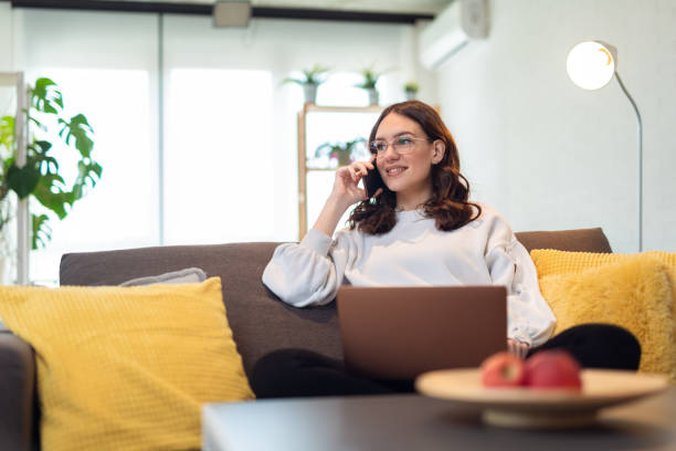 Attractive woman working from home. stock photo