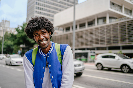 Portrait of black university student at Paulista Avenue in Sao Paulo , Brazil