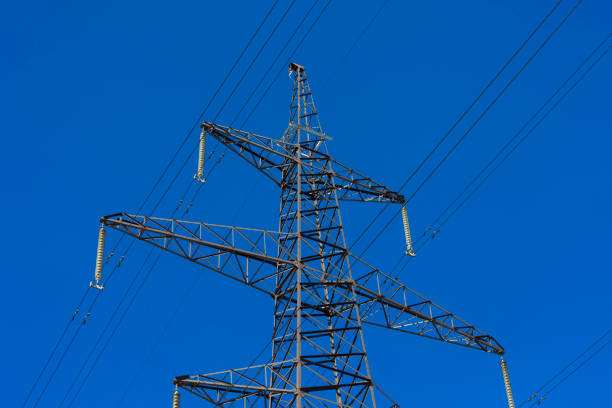 power transmission tower with insulators and wires stock photo