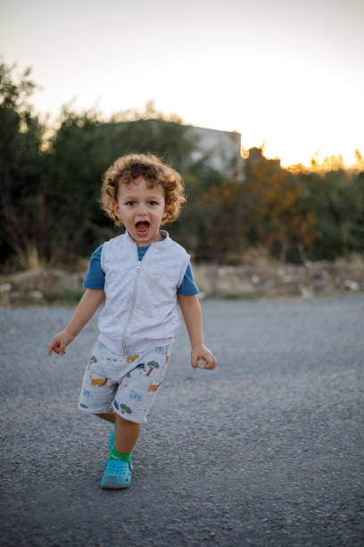 istock Cute boy having fun outdoors 1400306297