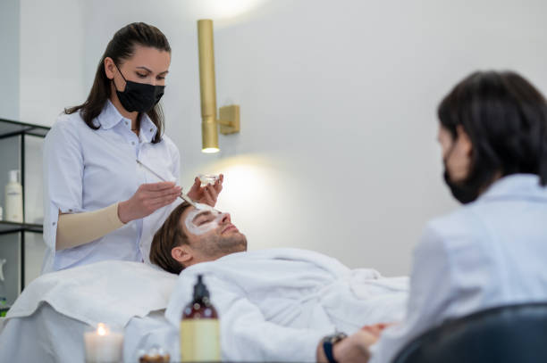 istock Cosmetologist working with the client in a spa salon 1400307832