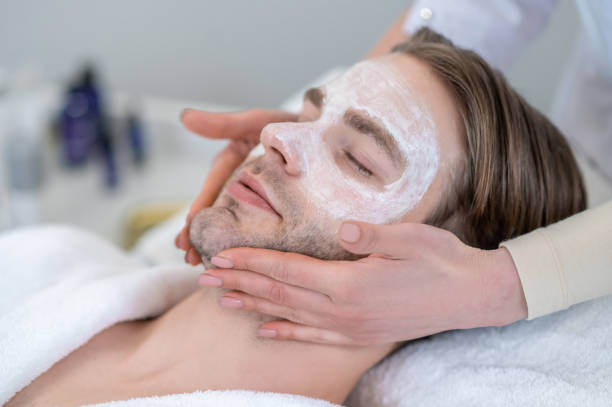 istock Young man with mask on his face having neck massage 1400307866