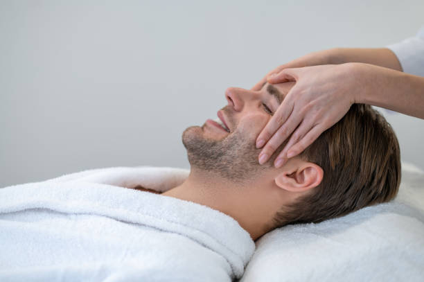 istock Close up of a man having face massage 1400307913