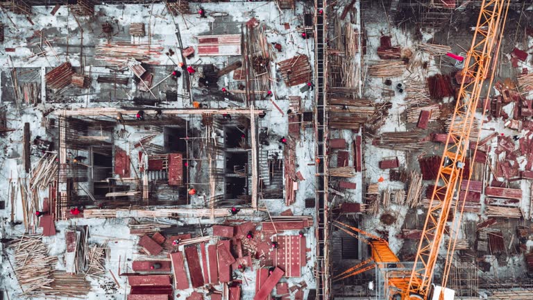 T/L PAN Drone Point View of Workers Working on Construction Site