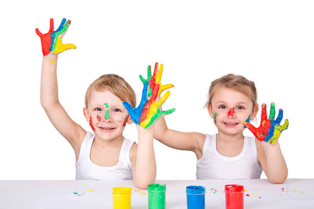 istock funny children painted with bright finger paints isolated on a white background 1400309586
