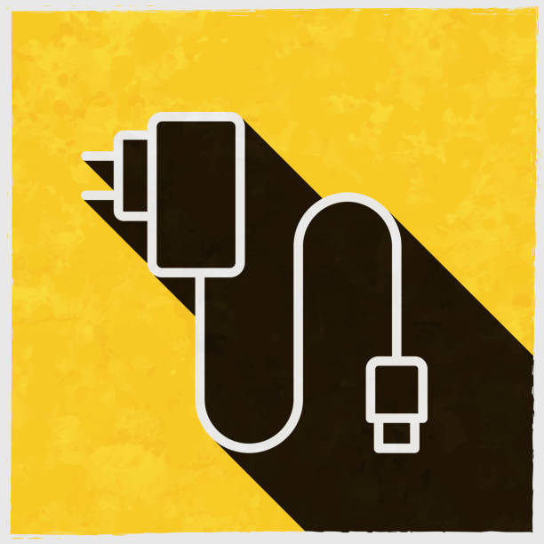 ilustrações, clipart, desenhos animados e ícones de carregador de celular. ícone com sombra longa no fundo amarelo texturizado - plug adapter charging mobile phone battery charger