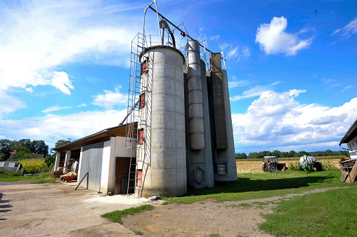 silo towers for storing bulk materials on a field in agriculture