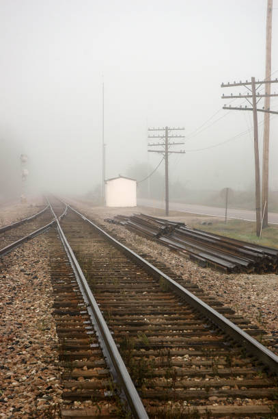 istock Trains - Tracks Disappear Into the Fog 1400310827