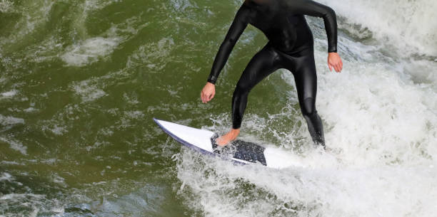 istock surfer on the surfboard in the water with waves 1400311939